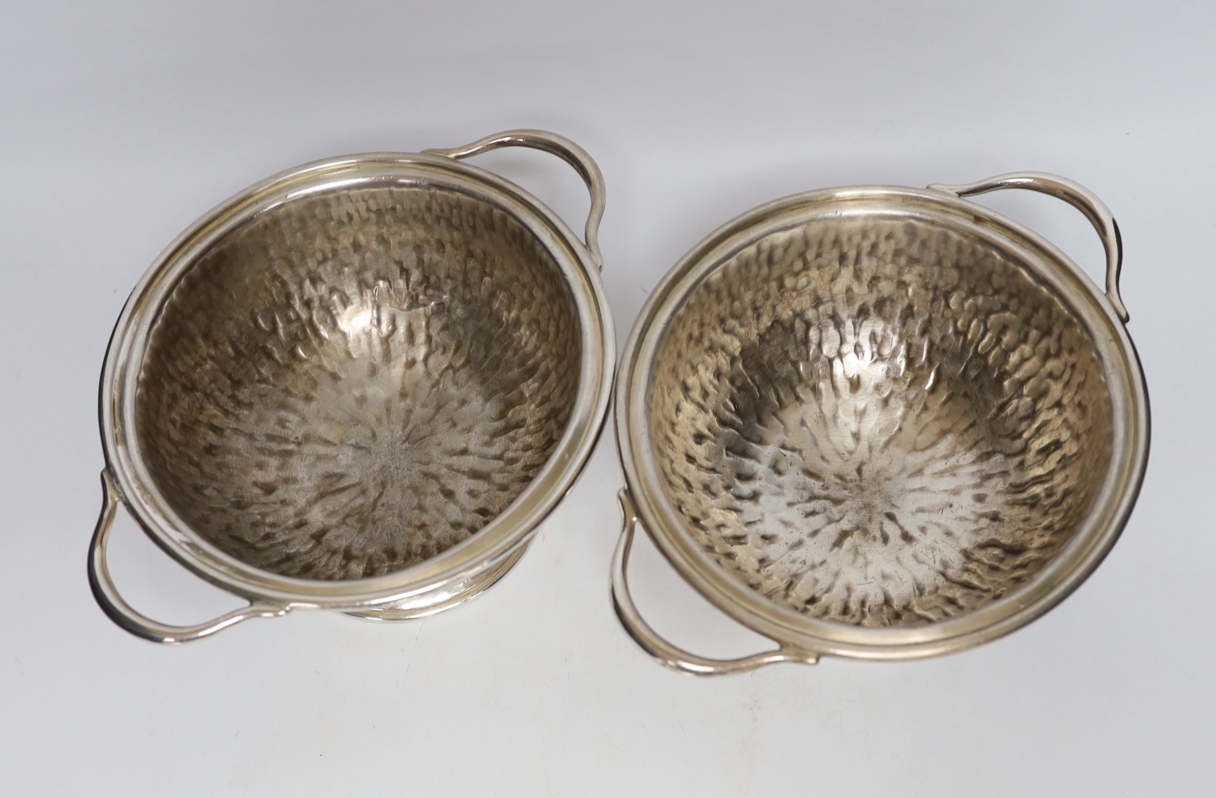 A pair of Hukin & Heath plated tureens and covers, attributed to Christopher Dresser, stamp to the bases, 27cm wide